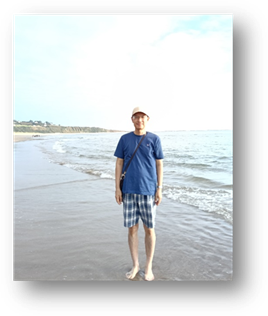 说明: A person standing on a beach